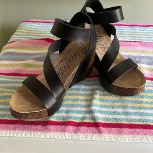Blowfish wedge sandal in black with Velcro closure.